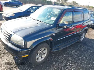 2003 Suzuki XL7 Touring z VIN JS3TX92VX34114687, wystawiony jako IAAI lot #40988145 z przebiegiem Nie podano mil oraz . Historia ofert i sprzedaży dostępna na DreamBid. Obrazek 2.