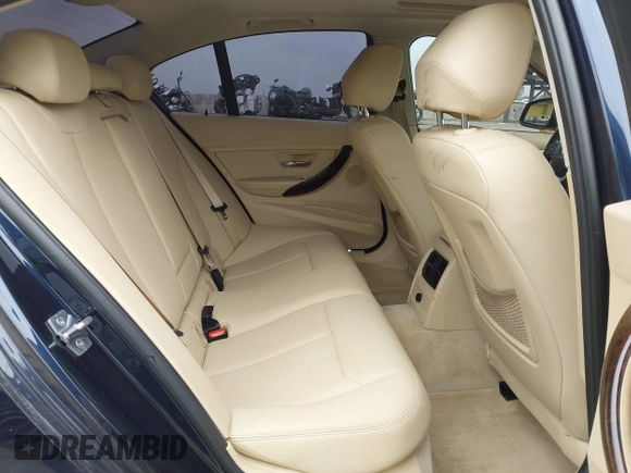 2014 BMW 3 Series 328i with VIN WBA3C1C56EK108665, listed as a IAAI auction lot 42101319 with 84,928 mi miles and . Bid and sale history available at DreamBid. Image 8.