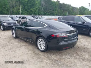 2017 Tesla Model S 60 with VIN 5YJSA1E1XHF232745, listed as a IAAI auction lot 41986834 with 89,581 mi miles and . Bid and sale history available at DreamBid. Image 3.