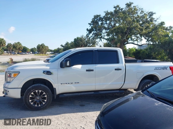 2016 Nissan Titan Platinum Reserve with VIN 1N6BA1F4XGN517905, listed as a IAAI auction lot 42676671 with 110,004 mi miles and . Bid and sale history available at DreamBid. Image 14.