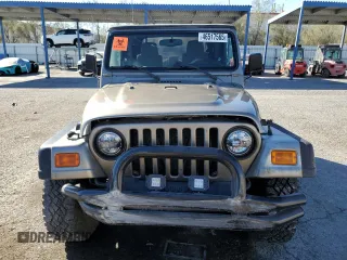 2003 Jeep Wrangler Sahara z VIN 1J4FA59S43P369233, wystawiony jako Copart lot #46517565 z przebiegiem 169 232 mil mil oraz Szkoda całkowita • Salvage title. Historia ofert i sprzedaży dostępna na DreamBid. Obrazek 5.
