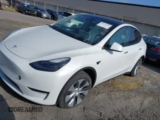 2024 Tesla Model Y with VIN 7SAYGDED2RF017448, listed as a IAAI auction lot 41597056 with 9,702 mi miles and . Bid and sale history available at DreamBid. Image 2.