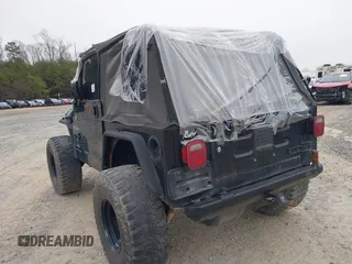 2003 Jeep Wrangler X with VIN 1J4FA39S33P375741, listed as a IAAI auction lot 40858427 with Not provided miles and . Bid and sale history available at DreamBid. Image 3.