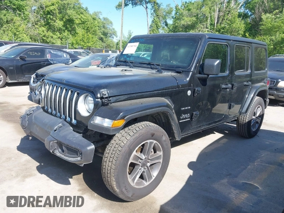 2023 Jeep Wrangler Sahara with VIN 1C4HJXEN5PW702268, listed as a IAAI auction lot 42288704 with 57,240 mi miles and . Bid and sale history available at DreamBid. Image 2.