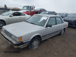 1985 Toyota Camry z VIN JT2SV16E9F0351378, wystawiony jako IAAI lot #42194705 z przebiegiem 192 476 mil mil oraz . Historia ofert i sprzedaży dostępna na DreamBid. Obrazek 2.