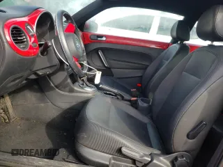 2012 Volkswagen Beetle 2.5L PZEV with VIN 3VWJP7AT0CM601196, listed as a Copart auction lot 44962065 with 128,597 mi miles and Salvage Title. Bid and sale history available at carsss.com. Image 7.