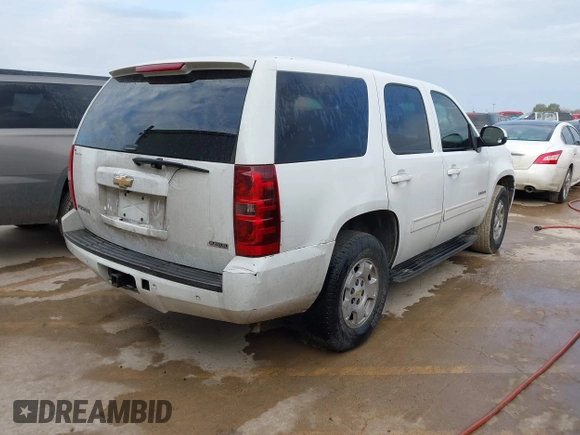 2010 Chevrolet Tahoe LS with VIN 1GNMCAE3XAR215407, listed as a IAAI auction lot 41570899 with 197,401 mi miles and . Bid and sale history available at DreamBid. Image 4.