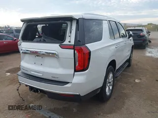 2021 GMC Yukon SLT with VIN 1GKS1BKD1MR489922, listed as a IAAI auction lot 40972652 with 77,791 mi miles. Bid and sale history available at carsss.com. Image 4.