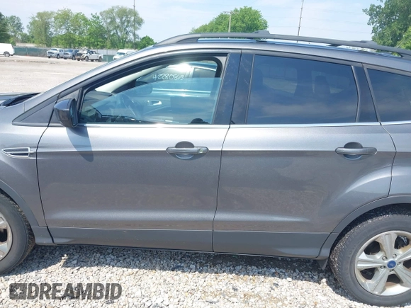 2013 Ford Escape SE with VIN 1FMCU0GX6DUB29519, listed as a IAAI auction lot 42281464 with 129,671 mi miles and . Bid and sale history available at DreamBid. Image 14.
