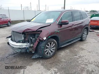 2019 Honda Pilot EX-L with VIN 5FNYF5H59KB026597, listed as a IAAI auction lot 41574993 with 67,750 mi miles. Bid and sale history available at carsss.com. Image 2.