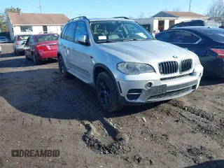 2011 BMW X5 35i with VIN 5UXZV4C59BL406947, listed as a IAAI auction lot 41684050 with 999,999 mi miles. Bid and sale history available at carsss.com. Image 1.