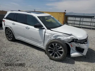 2023 Jeep Grand Cherokee Overland with VIN 1C4RJHDG9PC517056, listed as a Copart auction lot 54929955 with 18,418 mi miles and Salvage title. Bid and sale history available at DreamBid. Image 4.