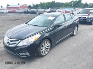 2014 Hyundai Azera Limited z VIN KMHFH4JG5EA353031, wystawiony jako IAAI lot #42481763 z przebiegiem 90 244 mil mil oraz . Historia ofert i sprzedaży dostępna na DreamBid. Obrazek 2.
