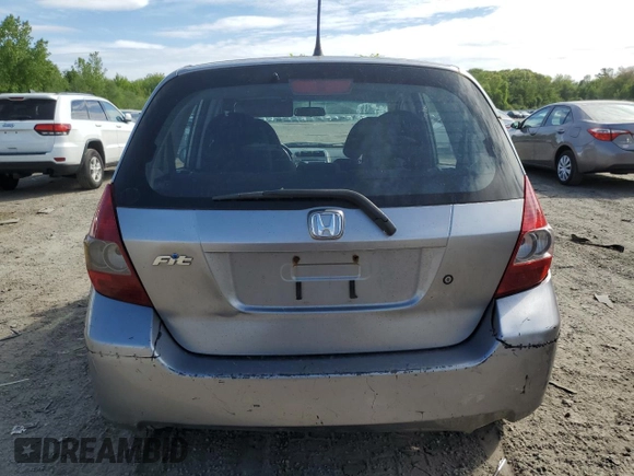 2007 Honda Fit z VIN JHMGD37427S059531, wystawiony jako Copart lot #57025775 z przebiegiem 224 576 mil mil oraz Czysty tytuł • Clean title. Historia ofert i sprzedaży dostępna na DreamBid. Obrazek 6.