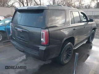 2015 GMC Yukon SLT with VIN 1GKS2BKC7FR110106, listed as a IAAI auction lot 41702260 with 108,679 mi miles. Bid and sale history available at carsss.com. Image 4.