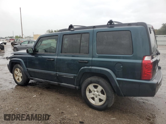 2006 Jeep Commander with VIN 1J8HH48NX6C125803, listed as a Copart auction lot 71247304 with 214,297 mi miles and Salvage Title. Bid and sale history available at carsss.com. Image 2.