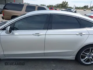 2016 Ford Fusion Titanium with VIN 3FA6P0K90GR132709, listed as a IAAI auction lot 41790873 with 63,269 mi miles and . Bid and sale history available at carsss.com. Image 14.