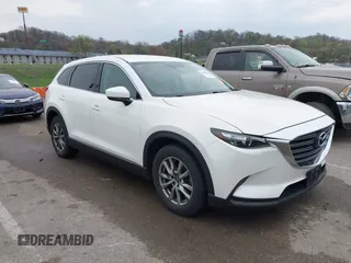 2016 Mazda CX-9 Touring with VIN JM3TCBCY1G0110297, listed as a IAAI auction lot 41914744 with 90,293 mi miles and . Bid and sale history available at DreamBid. Image 1.