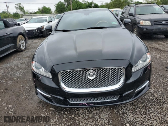 2013 Jaguar XJ Portfolio with VIN SAJWJ2GD0D8V44292, listed as a Copart auction lot 57073775 with 100,458 mi miles and Salvage Title. Bid and sale history available at DreamBid. Image 5.
