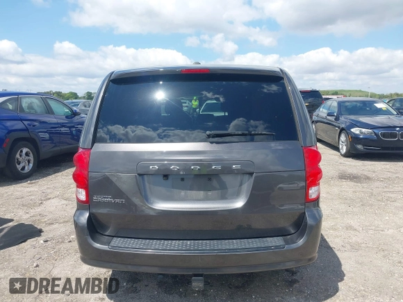 2015 Dodge Grand Caravan American Value with VIN 2C4RDGBGXFR682995, listed as a IAAI auction lot 41994708 with 142,725 mi miles and . Bid and sale history available at DreamBid. Image 16.