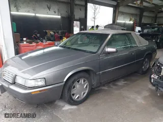 1999 Cadillac Eldorado ESC with VIN 1G6EL12Y8XU612393, listed as a IAAI auction lot 41761839 with 104,994 mi miles. Bid and sale history available at carsss.com. Image 2.