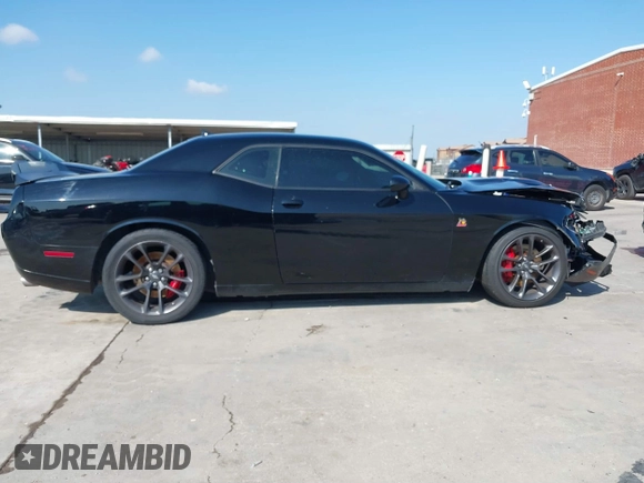 2021 Dodge Challenger R/T Scat Pack z VIN 2C3CDZFJXMH509833, wystawiony jako IAAI lot #41516858 z przebiegiem 66 880 mil mil oraz . Historia ofert i sprzedaży dostępna na DreamBid. Obrazek 13.