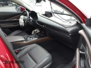 2023 Mazda CX-30 S Premium with VIN 3MVDMBDM1PM520048, listed as a IAAI auction lot 42468172 with 7,277 mi miles and . Bid and sale history available at DreamBid. Image 5.