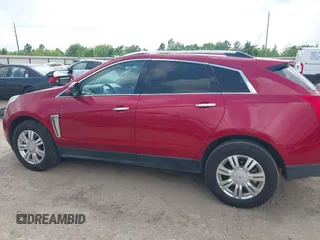 2014 Cadillac SRX Luxury Collection z VIN 3GYFNBE39ES576335, wystawiony jako IAAI lot #42093334 z przebiegiem 69 804 mil mil oraz . Historia ofert i sprzedaży dostępna na DreamBid. Obrazek 14.