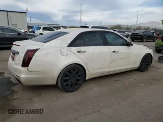 2014 Cadillac CTS Premium RWD z VIN 1G6AT5S30E0142990, wystawiony jako Copart lot #50801685 z przebiegiem 74 583 mil mil oraz Szkody całkowita. Historia ofert i sprzedaży dostępna na DreamBid. Obrazek 3.