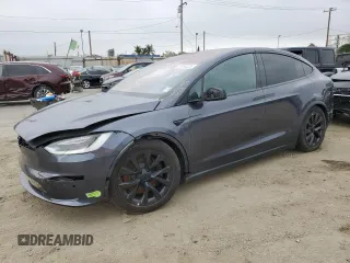 2023 Tesla Model X z VIN 7SAXCBE57PF381107, wystawiony jako Copart lot #59194225 z przebiegiem 21 552 mil mil oraz Szkoda całkowita • Salvage title. Historia ofert i sprzedaży dostępna na DreamBid. Obrazek 1.