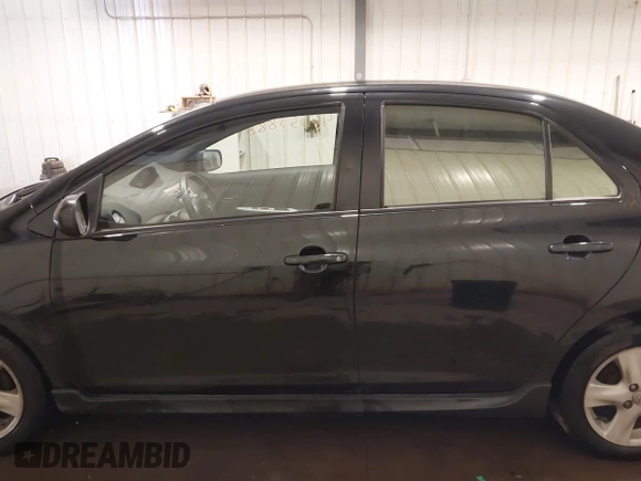 2008 Toyota Yaris with VIN JTDBT903581284634, listed as a IAAI auction lot 40553888 with 180,563 mi miles. Bid and sale history available at carsss.com. Image 14.