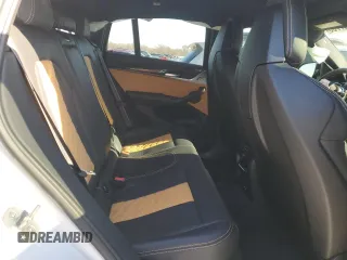 2022 BMW X4 M z VIN 5YM23EC04N9K50909, wystawiony jako Copart lot #87947765 z przebiegiem 27 474 mil mil oraz Szkoda całkowita • Salvage title. Historia ofert i sprzedaży dostępna na DreamBid. Obrazek 11.
