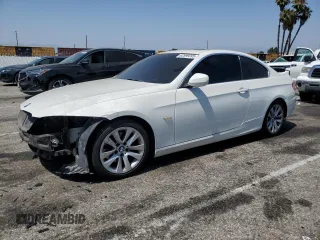 2012 BMW 3 Series 328i with VIN WBAKE5C50CJ106099, listed as a Copart auction lot 62599395 with 169,135 mi miles and Salvage title. Bid and sale history available at DreamBid. Image 1.
