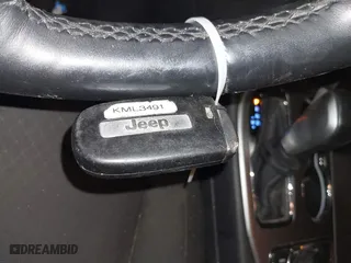 2018 Jeep Grand Cherokee Laredo E with VIN 1C4RJFAG9JC359284, listed as a IAAI auction lot 41032232 with 163,679 mi miles. Bid and sale history available at carsss.com. Image 11.