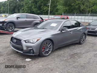 2021 Infiniti Q50 Red Sport 400 with VIN JN1FV7DR2MM880505, listed as a IAAI auction lot 42377058 with 59,618 mi miles and . Bid and sale history available at DreamBid. Image 2.
