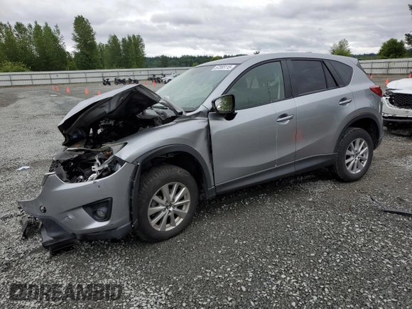2014 Mazda CX-5 Touring z VIN JM3KE4CYXE0426408, wystawiony jako Copart lot #57355115 z przebiegiem Nie podano mil oraz Szkody całkowita. Historia ofert i sprzedaży dostępna na DreamBid. Obrazek 1.