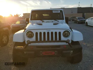 2015 Jeep Wrangler Unlimited Rubicon with VIN 1C4BJWFG5FL659017, listed as a Copart auction lot 84435034 with 69,915 mi miles and Salvage Title. Bid and sale history available at carsss.com. Image 5.