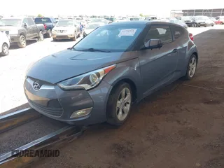 2014 Hyundai Veloster RE:FLEX z VIN KMHTC6AD2EU197984, wystawiony jako IAAI lot #41721931 z przebiegiem 107 252 mil mil oraz . Historia ofert i sprzedaży dostępna na DreamBid. Obrazek 2.