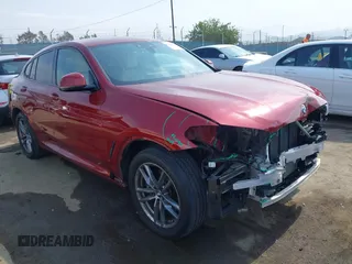 2021 BMW X4 xDrive30i with VIN 5UX2V1C09M9F29509, listed as a IAAI auction lot 42408605 with 46,992 mi miles and . Bid and sale history available at DreamBid. Image 1.