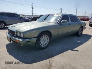 1999 Jaguar XJ with VIN SAJHX604XXC854217, listed as a Copart auction lot 56042735 with 127,092 mi miles and Salvage title. Bid and sale history available at DreamBid. Image 1.