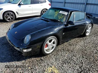 1996 Porsche 911 z VIN WP0AC2992TS375986, wystawiony jako Copart lot #74504624 z przebiegiem Nie podano mil oraz Szkoda całkowita • Salvage title. Historia ofert i sprzedaży dostępna na DreamBid. Obrazek 1.