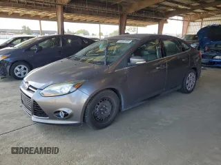 2014 Ford Focus Titanium with VIN 1FADP3J22EL224591, listed as a Copart auction lot 60902895 with 92,684 mi miles and Salvage title. Bid and sale history available at DreamBid. Image 1.