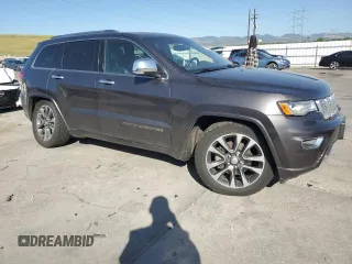 2017 Jeep Grand Cherokee Overland with VIN 1C4RJFCG9HC601806, listed as a Copart auction lot 61786275 with 122,898 mi miles and Salvage title. Bid and sale history available at DreamBid. Image 4.