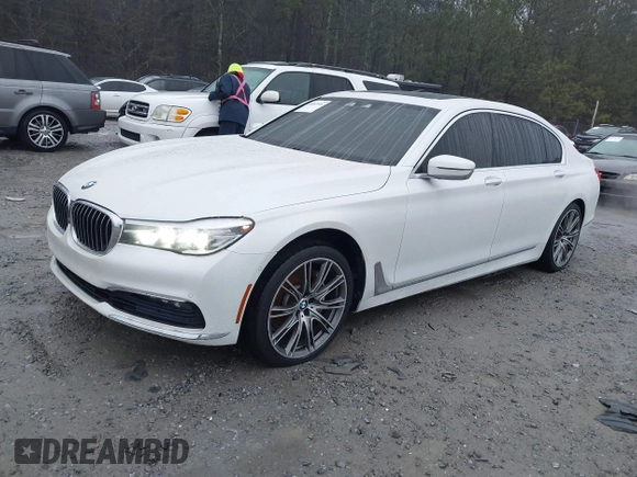 2017 BMW 7 Series 740i z VIN WBA7E2C51HG740000, wystawiony jako IAAI lot #41407048 z przebiegiem 114 929 mil mil oraz . Historia ofert i sprzedaży dostępna na DreamBid. Obrazek 2.