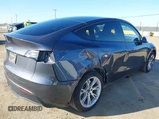 2023 Tesla Model Y Long Range with VIN 7SAYGAEE5PF964083, listed as a IAAI auction lot 41365919 with 26,008 mi miles and . Bid and sale history available at carsss.com. Image 4.