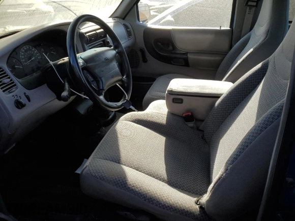 1999 Ford Ranger XL with VIN 1FTYR14V2XPA59072, listed as a Copart auction lot 84061714 with 193,166 mi miles and Salvage title. Bid and sale history available at DreamBid. Image 7.