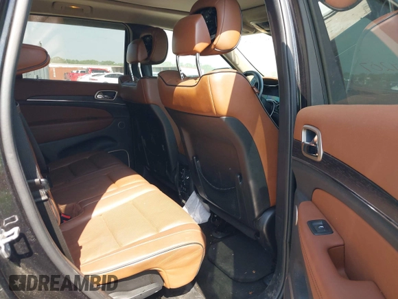 2015 Jeep Grand Cherokee Summit with VIN 1C4RJFJM1FC867861, listed as a IAAI auction lot 42034207 with 92,205 mi miles and . Bid and sale history available at DreamBid. Image 8.