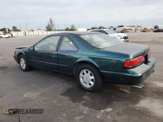 1994 Ford Thunderbird LX with VIN 1FALP62W6RH128762, listed as a Copart auction lot 84306604 with 68,314 mi miles and Salvage Title. Bid and sale history available at DreamBid. Image 2.