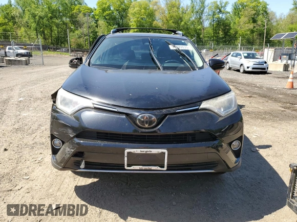 2018 Toyota RAV4 XLE with VIN 2T3WFREVXJW471443, listed as a Copart auction lot 54890655 with 131,677 mi miles and Salvage title. Bid and sale history available at DreamBid. Image 5.