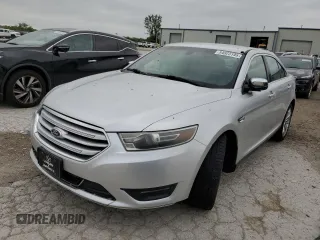 2015 Ford Taurus Limited with VIN 1FAHP2F80FG104436, listed as a Copart auction lot 54823195 with 133,327 mi miles and Salvage title. Bid and sale history available at DreamBid. Image 1.